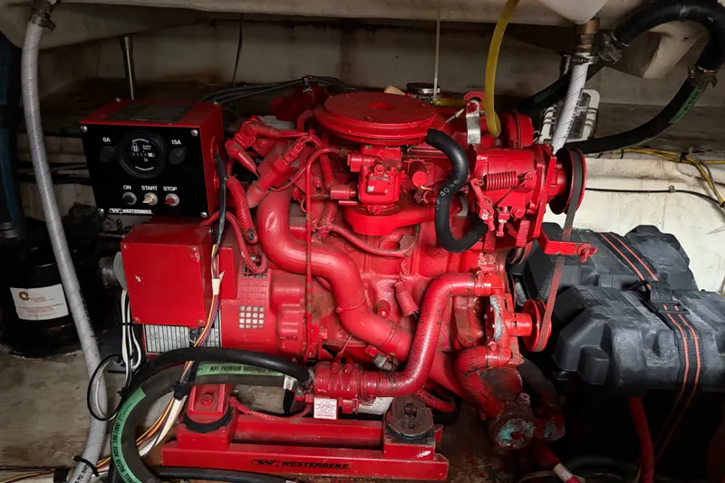 Slide: The Image of Red engine in a 1997 Maxum 4100 SCR boat, featuring detailed mechanical components. - 36