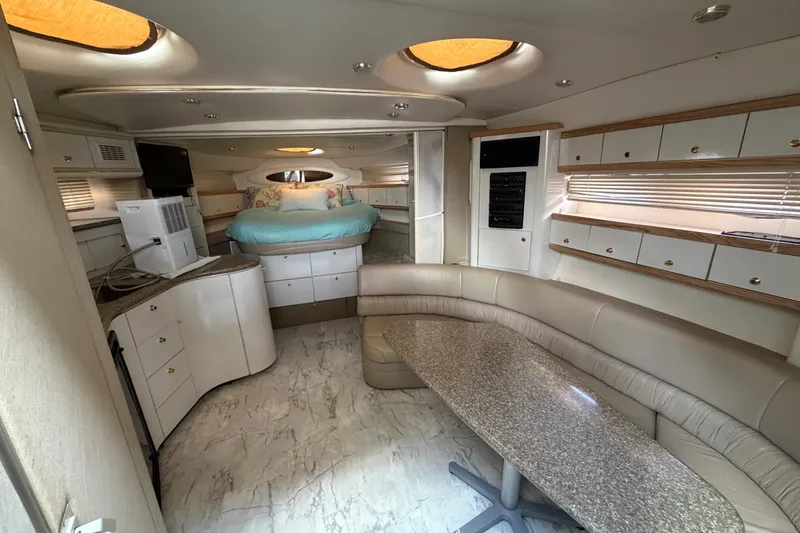 Slide: The Image of Luxurious interior of a 1997 Maxum 4100 SCR yacht with modern amenities. - 4