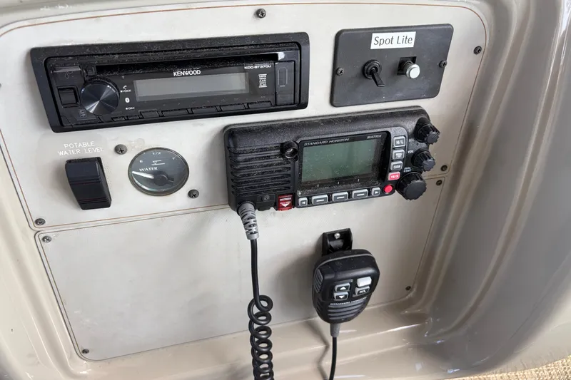 Slide: The Image of Control panel of a 1997 Maxum 4100 SCR boat with radio and water level gauge. - 26