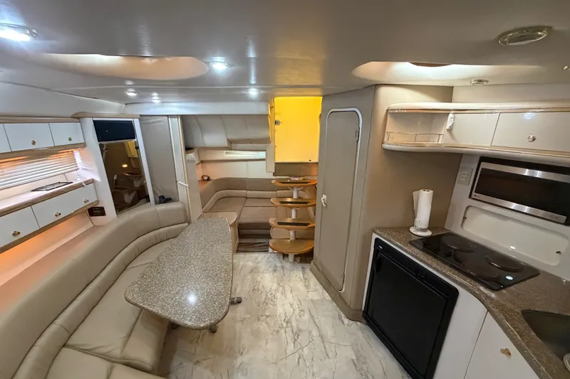 Slide: The Image of Luxurious interior of a 1997 Maxum 4100 SCR yacht with modern amenities. - 21