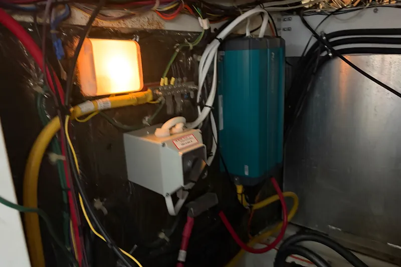 Slide: The Image of Electrical wiring and components inside a 1997 Maxum 4100 SCR boat. - 38