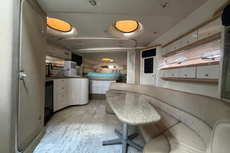 Slide: The Image of Luxurious interior of a 1997 Maxum 4100 SCR yacht with modern amenities. - 6