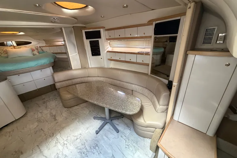 Slide: The Image of Luxurious interior of a 1997 Maxum 4100 SCR yacht with plush seating and elegant design. - 5