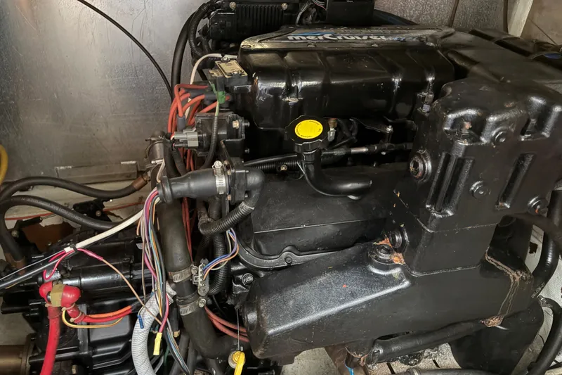 Slide: The Image of Engine compartment of a 1997 Maxum 4100 SCR boat, featuring a MerCruiser engine. - 37