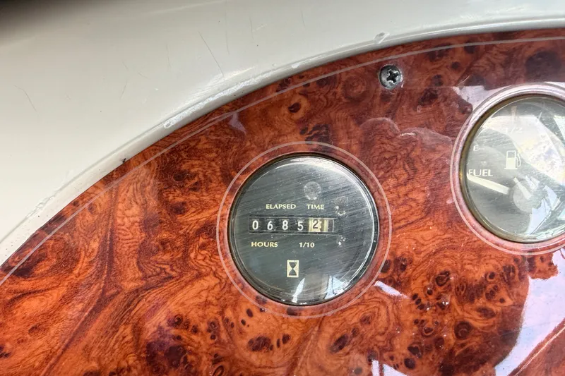 Slide: The Image of Dashboard of a 1997 Maxum 4100 SCR boat showing elapsed time and fuel gauge. - 29