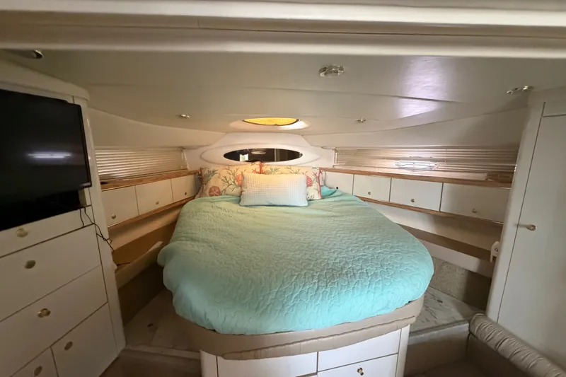 Slide: The Image of Luxurious 1997 Maxum 4100 SCR yacht cabin with cozy bed and elegant decor. - 15