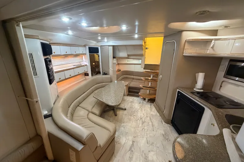 Slide: The Image of Luxurious interior of a 1997 Maxum 4100 SCR yacht with modern amenities. - 18