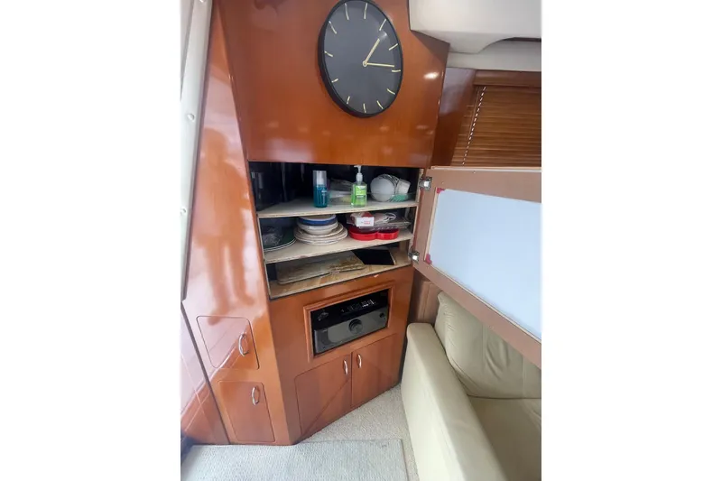 Slide: The Image of HIDDEN SALON STORAGE BEHIND A HINGED PICTURE WITH WALL CLOCK & AV RECEIVER - 13
