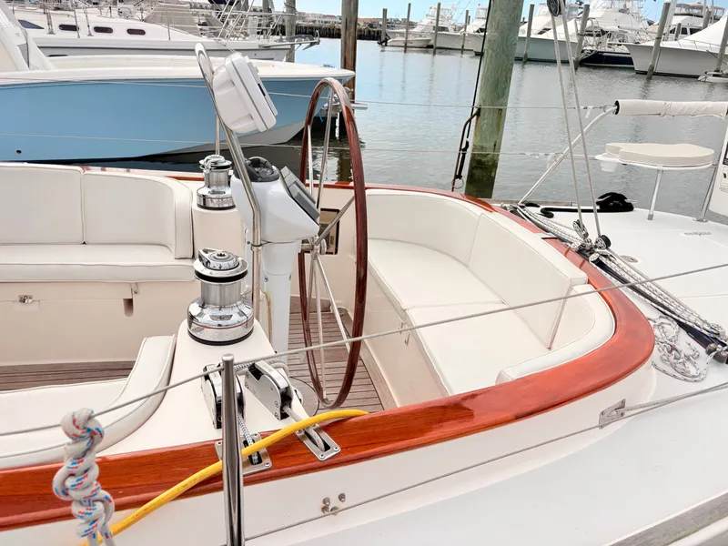 Slide: The Image of The image shows the cockpit of a 2009 Alerion Express 38 with a wooden steering wheel. - 22