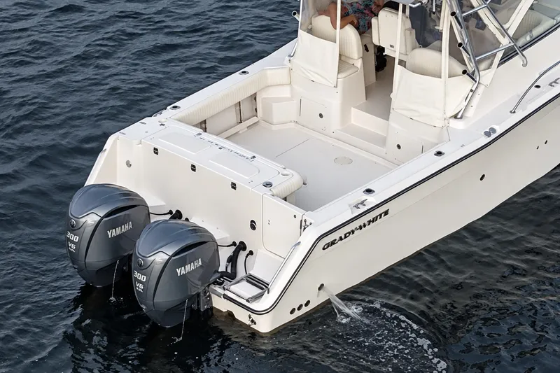 Slide: The Image of 2008 Grady-White Express 330 boat with twin Yamaha 300 V6 engines on water. - 3