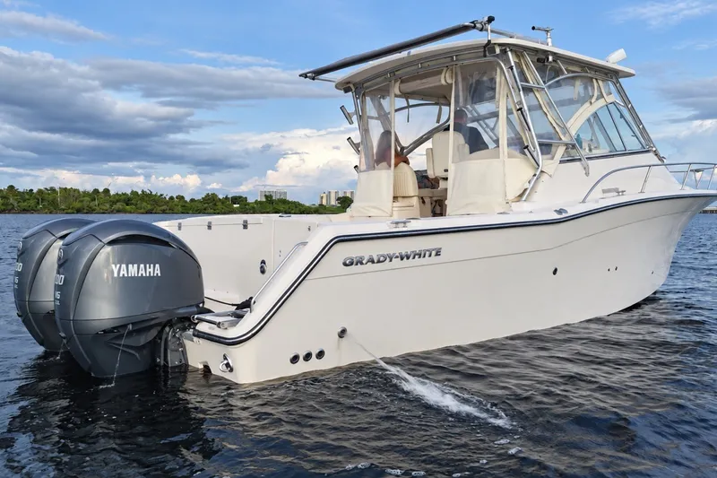 The Image of 2008 Grady-White Express 330 boat with Yamaha engines on calm water. - 0