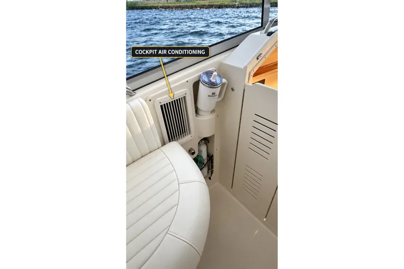 Slide: The Image of 2008 Grady-White Express 330 cockpit air conditioning vent detail. - 21