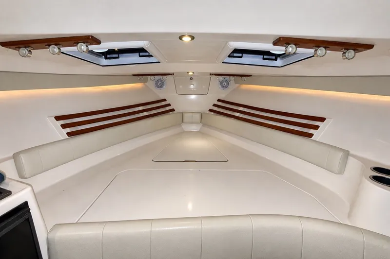 Slide: The Image of 2008 Grady-White Express 330 cabin interior with seating and wood accents. - 37