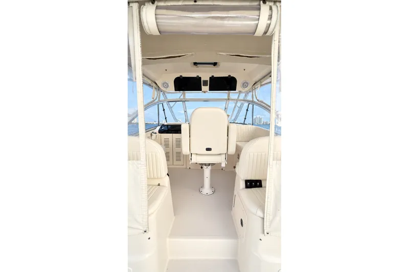 Slide: The Image of 2008 Grady-White Express 330 boat interior with helm and seating area. - 19