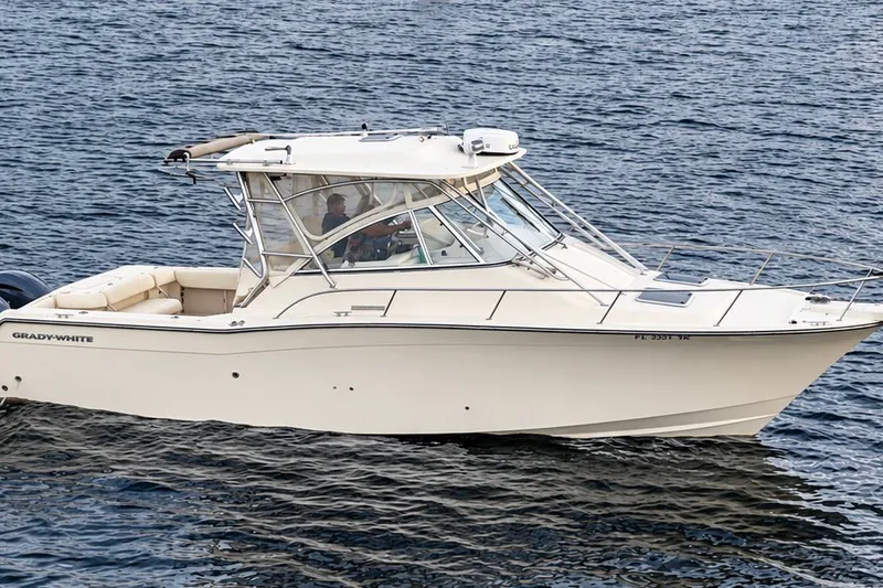 Slide: The Image of 2008 Grady-White Express 330 boat cruising on open water. - 7