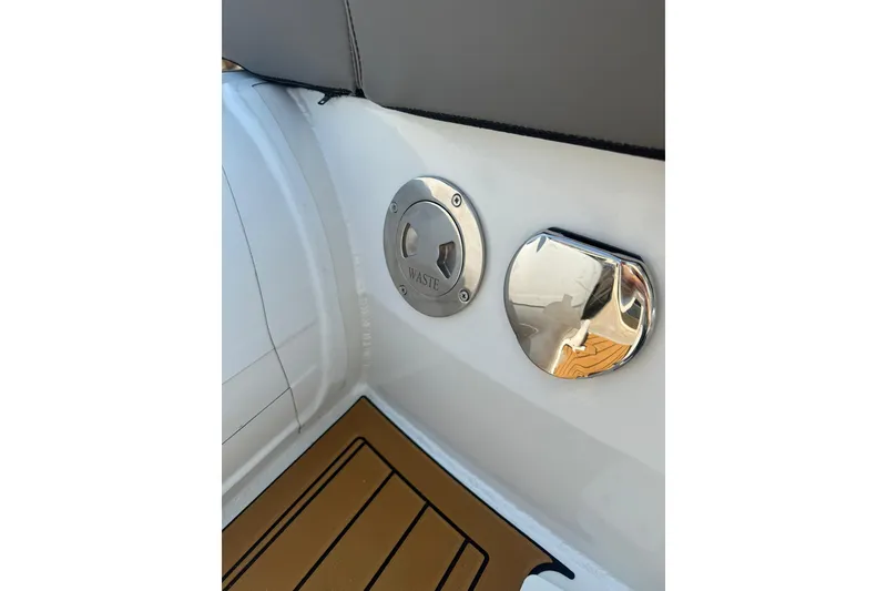 Slide: The Image of Waste disposal and fuel cap on 2027 Tide Craft 26 Capri boat deck. - 14