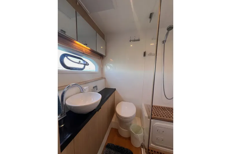 Slide: The Image of Luxurious bathroom in 2018 Aquila 44 Yacht with modern fixtures and elegant design. - 36