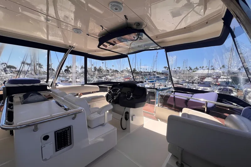 Slide: The Image of Interior view of 2018 Aquila 44 Yacht with marina backdrop. - 11