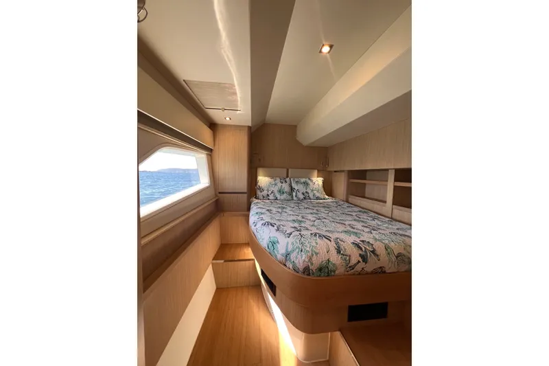 Slide: The Image of Luxurious interior cabin of 2018 Aquila 44 Yacht with ocean view window. - 34