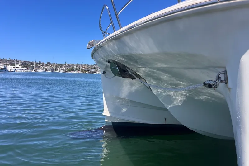 Slide: The Image of Aquila 44 Yacht 2018 anchored in a serene marina under clear blue skies. - 68