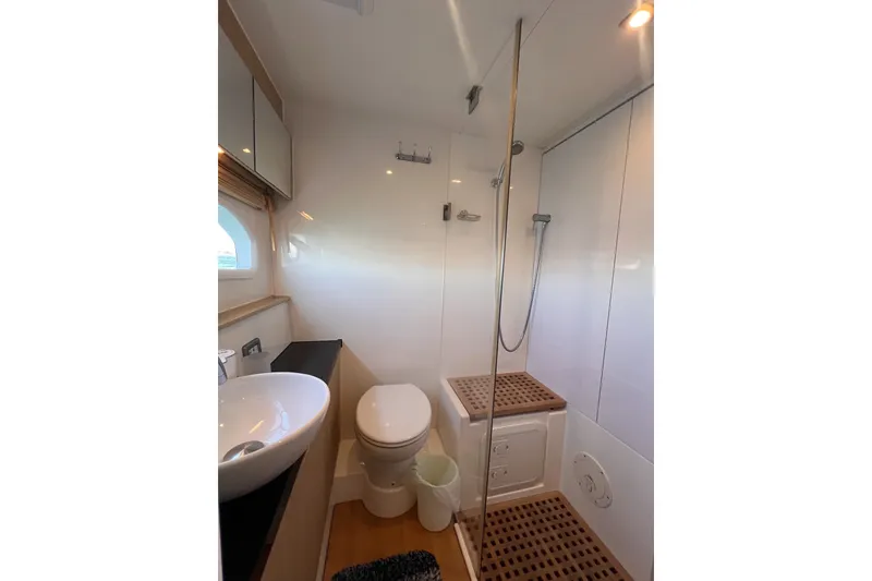 Slide: The Image of Modern bathroom in 2018 Aquila 44 Yacht with shower, sink, and toilet. - 35