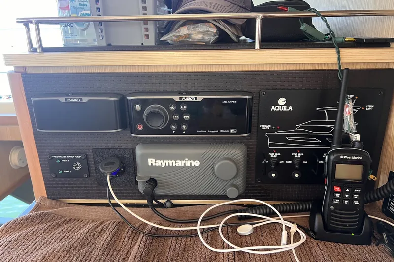 Slide: The Image of Control panel of a 2018 Aquila 44 Yacht with navigation and communication equipment. - 36