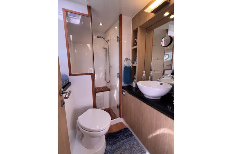 Slide: The Image of Luxurious bathroom in 2018 Aquila 44 Yacht with modern fixtures and elegant design. - 53