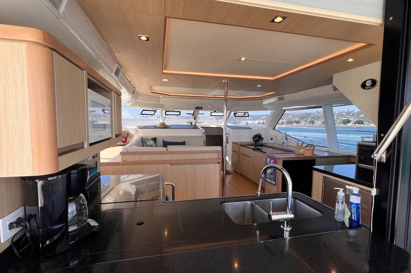 Slide: The Image of Luxurious interior of 2018 Aquila 44 Yacht with modern kitchen and scenic ocean view. - 47