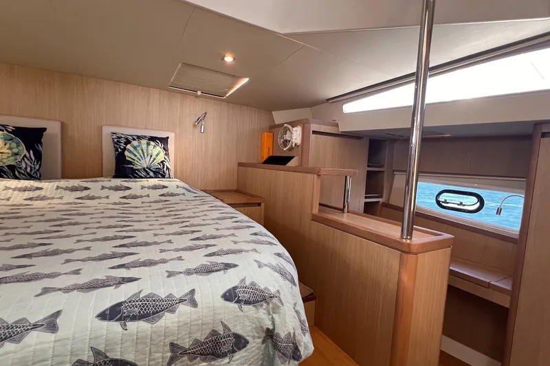 Slide: The Image of Luxurious cabin interior of 2018 Aquila 44 Yacht with nautical-themed bedding. - 60