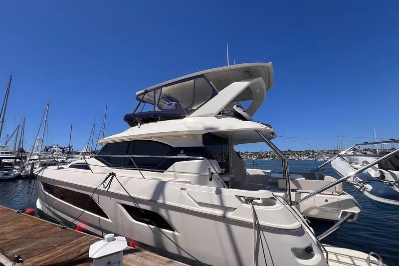 Slide: The Image of 2018 Aquila 44 Yacht docked at marina under clear blue sky. - 9