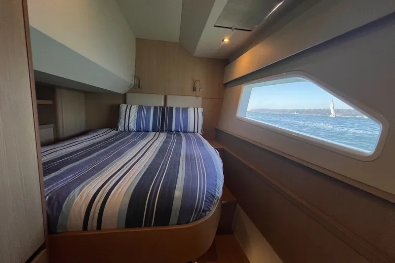 Slide: The Image of Cozy cabin interior of 2018 Aquila 44 Yacht with ocean view through window. - 39