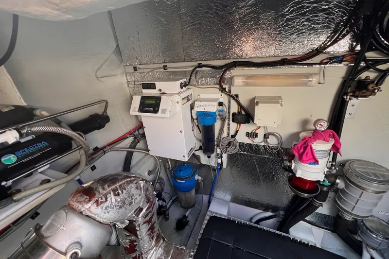 Slide: The Image of Engine room of 2018 Aquila 44 Yacht with Spectra watermaker system and various equipment. - 77
