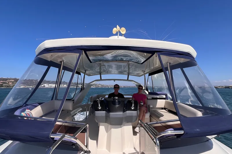 Slide: The Image of 2018 Aquila 44 Yacht cruising on open water under clear blue skies. - 20