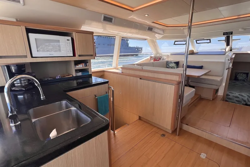 Slide: The Image of Luxurious interior of 2018 Aquila 44 Yacht with modern kitchen and dining area. - 46
