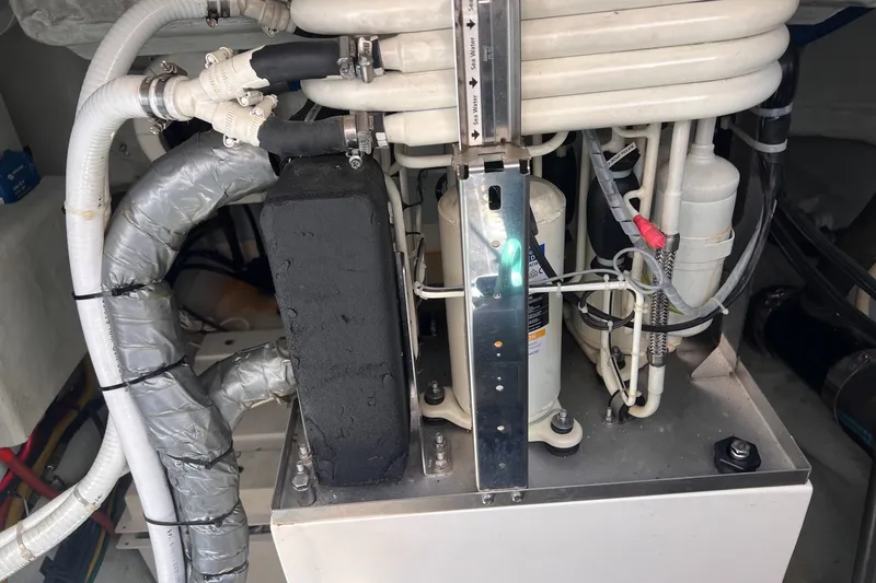Slide: The Image of Engine room of a 2018 Aquila 44 Yacht showing mechanical components and piping. - 74