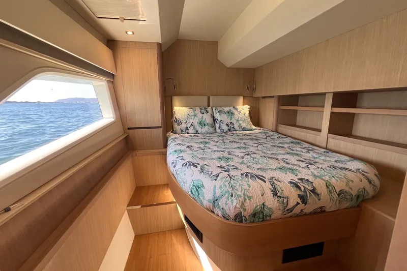 Slide: The Image of Luxurious bedroom interior of 2018 Aquila 44 Yacht with ocean view window. - 33