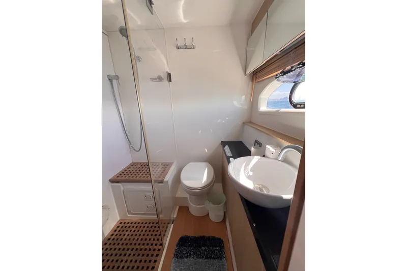 Slide: The Image of Modern bathroom interior on 2018 Aquila 44 Yacht with shower, toilet, and sink. - 30