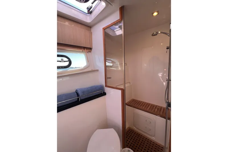 Slide: The Image of Bathroom interior of 2018 Aquila 44 Yacht with shower and window. - 52
