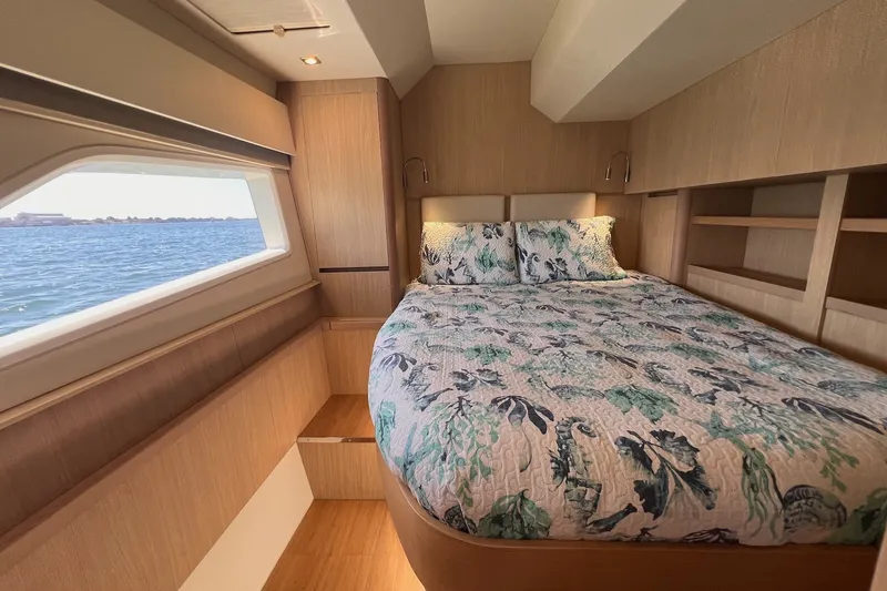 Slide: The Image of Cozy bedroom in 2018 Aquila 44 Yacht with ocean view and floral bedding. - 32