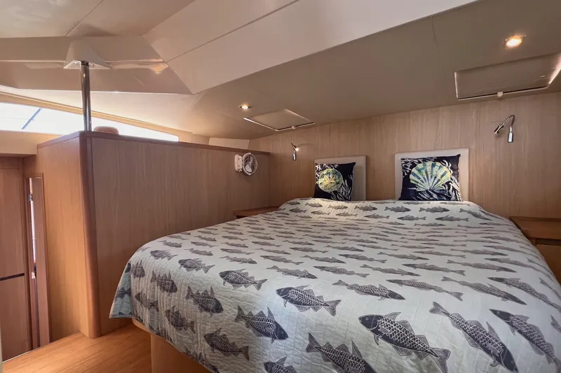Slide: The Image of Cozy bedroom interior of 2018 Aquila 44 Yacht with fish-patterned bedding. - 29