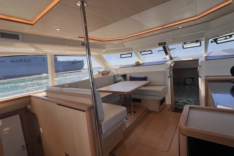 Slide: The Image of Luxurious interior of 2018 Aquila 44 Yacht with elegant seating and panoramic windows. - 45