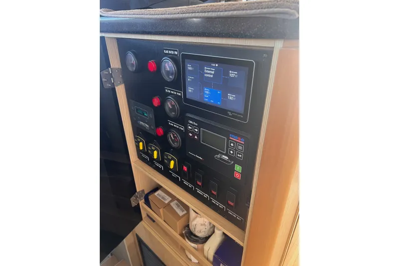 Slide: The Image of Control panel of 2018 Aquila 44 Yacht with digital display and switches. - 35