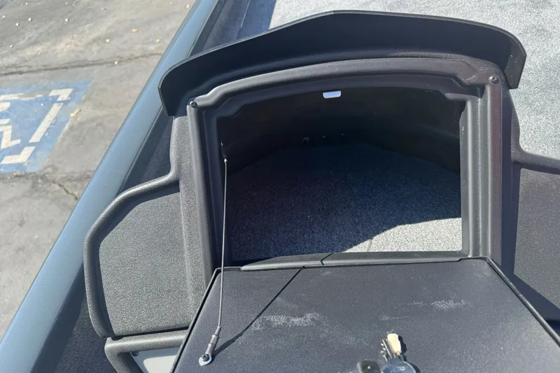 Slide: The Image of Open storage compartment on 2027 Ranger RT198P boat, showing interior details. - 17