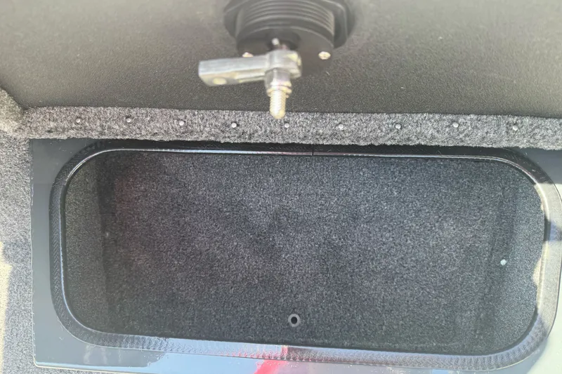 Slide: The Image of Storage compartment in 2027 Ranger RT198P boat, featuring a secure latch mechanism. - 15