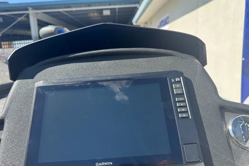 Slide: The Image of Garmin display on 2027 Ranger RT198P boat dashboard, under sunny conditions. - 19
