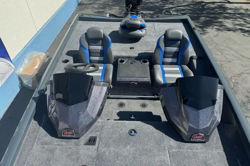 Slide: The Image of 2027 Ranger RT198P boat interior with dual seats and steering console. - 11