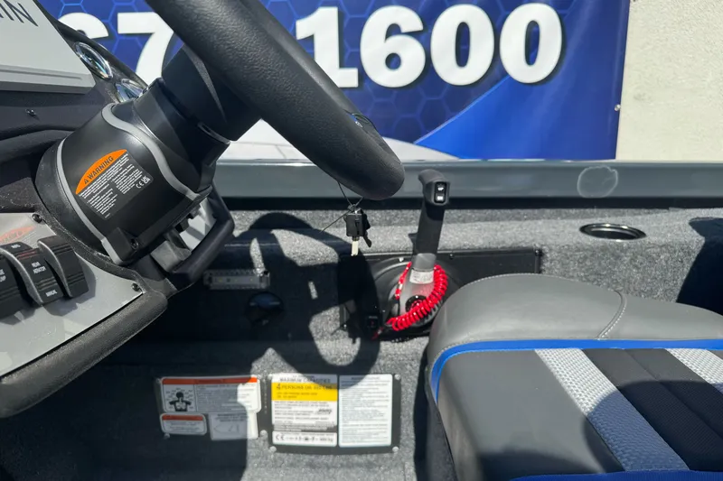 Slide: The Image of Interior of a 2027 Ranger RT198P boat showing steering wheel and controls. - 20