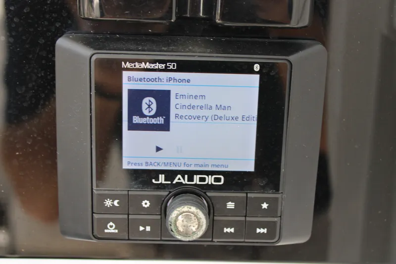 Slide: The Image of JL Audio MediaMaster 50 displaying Bluetooth connection and song details on Sea Hunt BX25FS. - 25