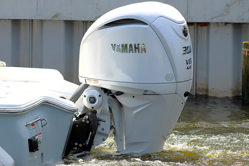 Slide: The Image of 2022 Sea Hunt BX25FS boat with Yamaha 300 V6 outboard motor in water. - 42