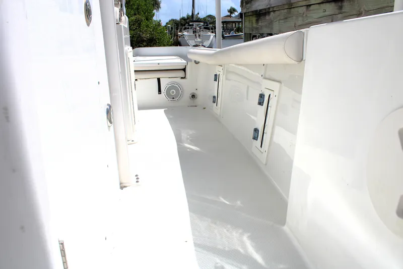 Slide: The Image of 2022 Sea Hunt BX25FS boat interior with storage compartments and speaker. - 17